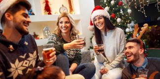 friends gathered for the holidays with festive drinks