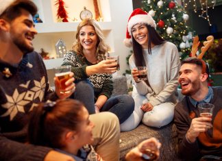 friends gathered for the holidays with festive drinks