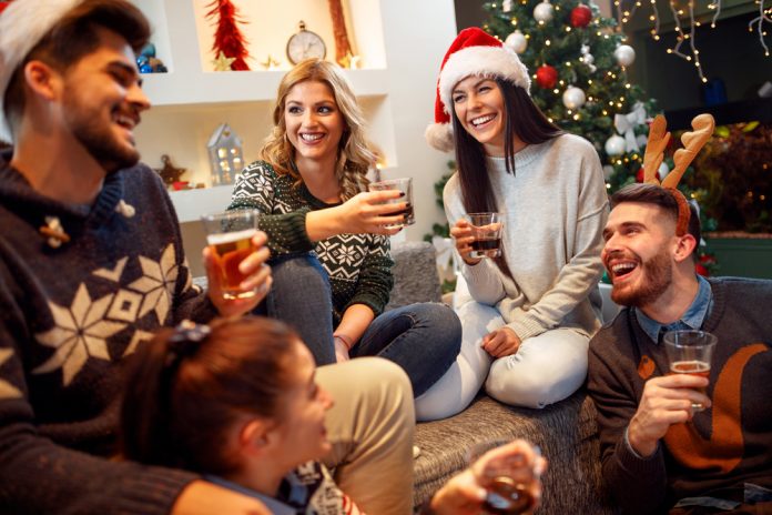 friends gathered for the holidays with festive drinks